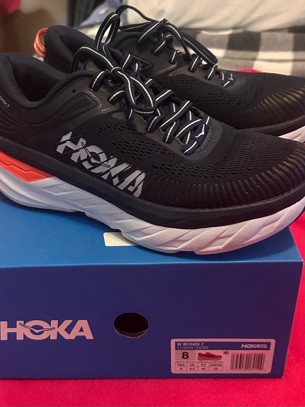 Hoka women’s Bondi 7 Black with White and Orange Running Shoes